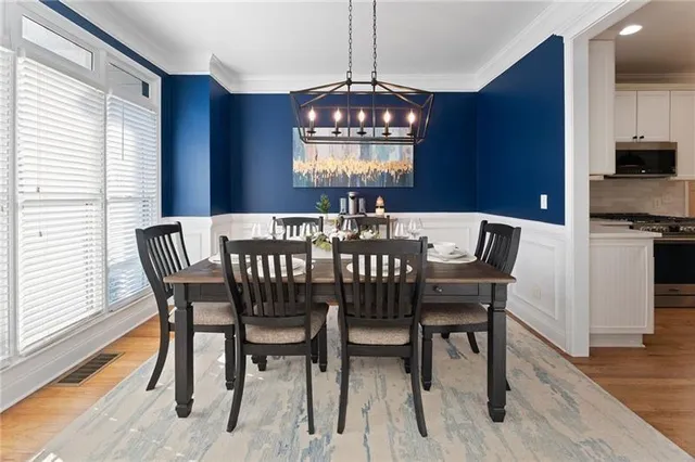 a kitchen with stainless steel appliances kitchen island a island in the center