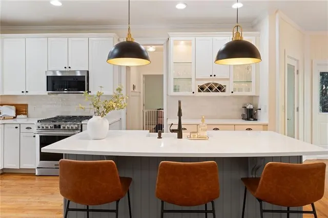 a bathroom with a washing machine and a sink