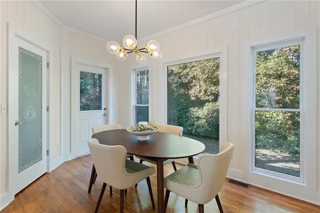 a view of a balcony with wooden floor and outdoor space