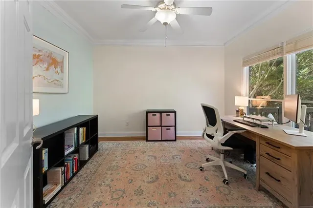 a bathroom with a granite countertop sink toilet and a mirror