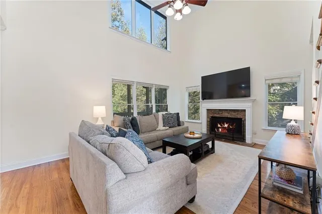 a living room with furniture fireplace and a flat screen tv