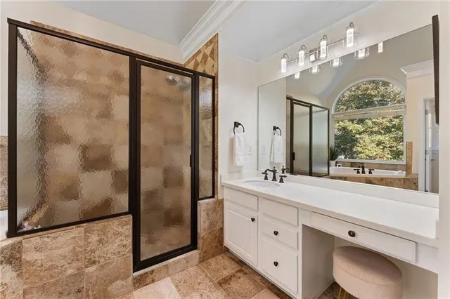 a bathroom with a bathtub and a shower