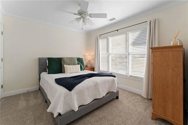 a view of a room with gym equipment and floor to ceiling window