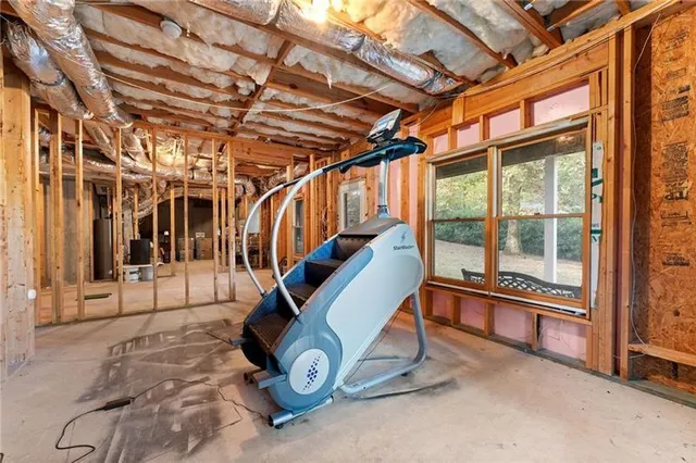 an aerial view of a house with a yard and garden