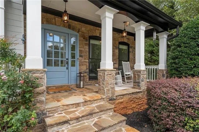 a view of house with backyard outdoor seating and plants