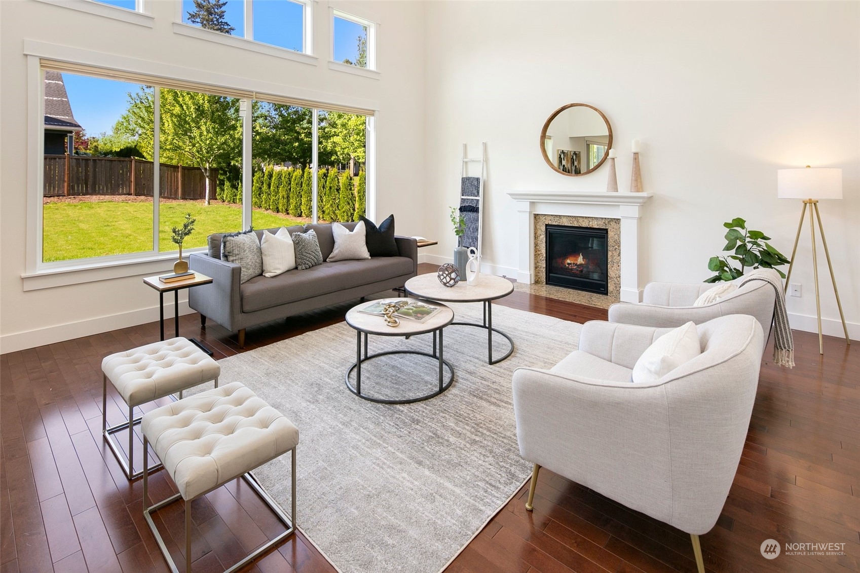 5226 Northeast 2nd Street Renton, WA 98059 - Photo 3 of 40 a living room with furniture a fireplace and a large window