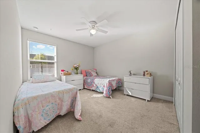 a bedroom with bed and window