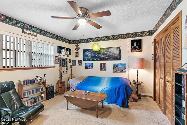 a view of a house with a patio and backyard