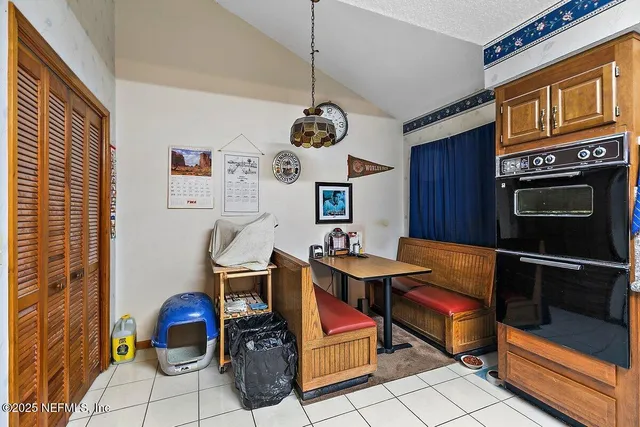 a room with furniture a rug and a window