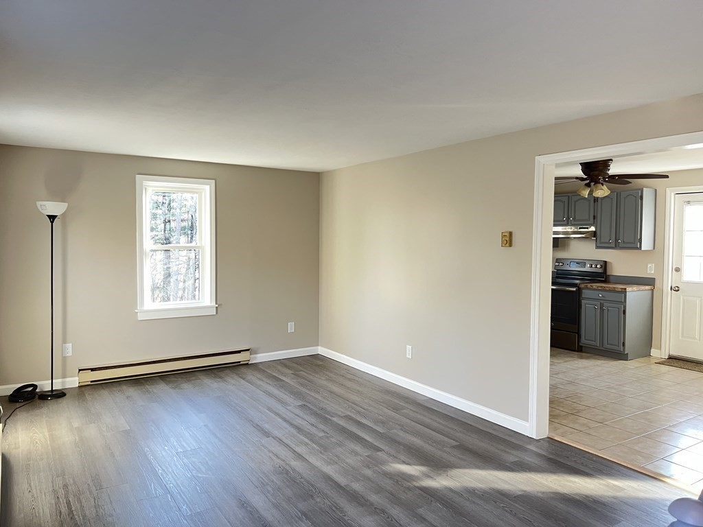 1124 Bemis Road, Unit B Warren, MA 01585 - Photo 20 of 42 a view of kitchen with wooden floor electronic appliances and window