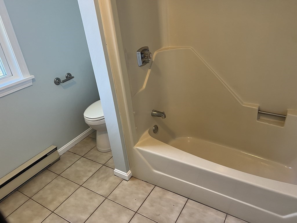 1124 Bemis Road, Unit B Warren, MA 01585 - Photo 27 of 42 a bathroom with a sink a toilet and a bathtub