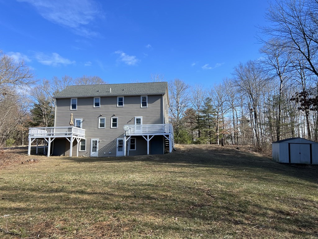 1124 Bemis Road, Unit B Warren, MA 01585 - Photo 3 of 42 a view of a house with a big yard
