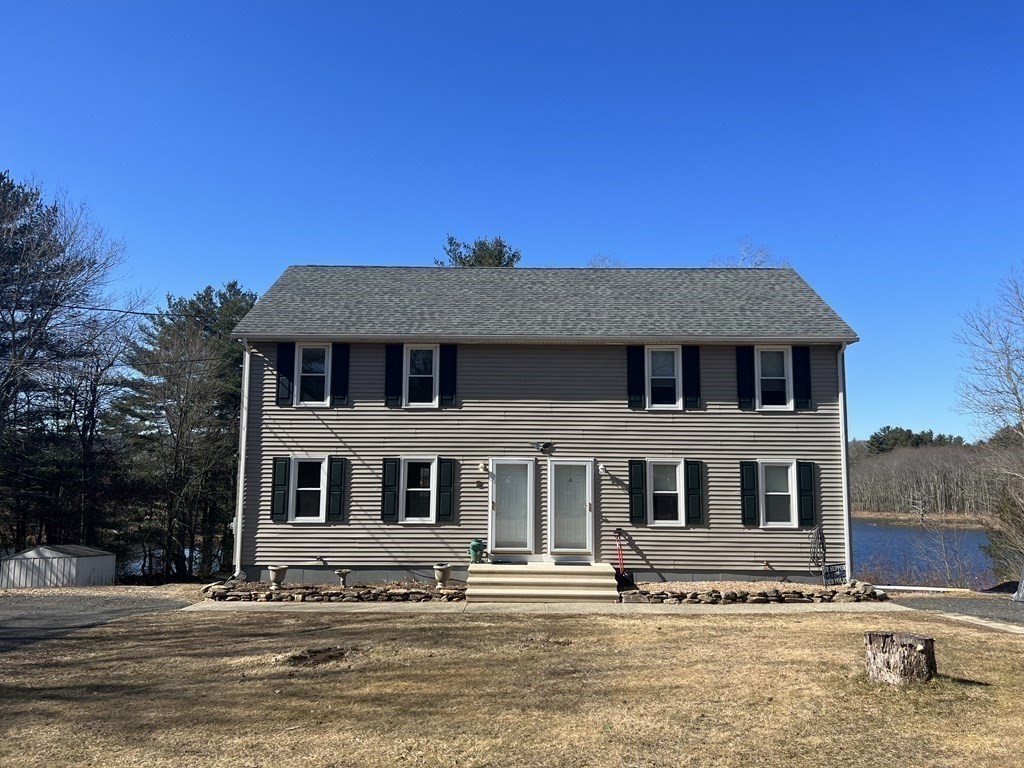 1124 Bemis Road, Unit B Warren, MA 01585 - Photo 38 of 42 a view of a big house with a big yard