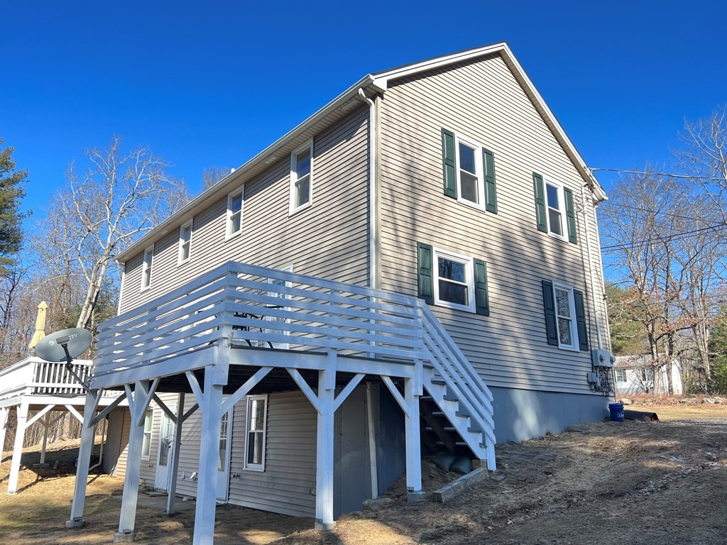 1124 Bemis Road, Unit B Warren, MA 01585 - Photo 4 of 42 a view of a house with wooden fence