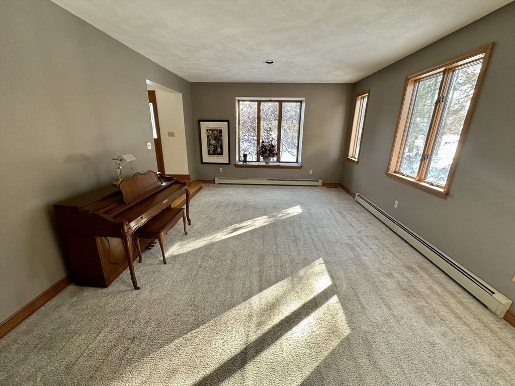 42 Pine Acres Road Foxboro, MA 02035 - Photo 19 of 40 a living room with furniture and a window