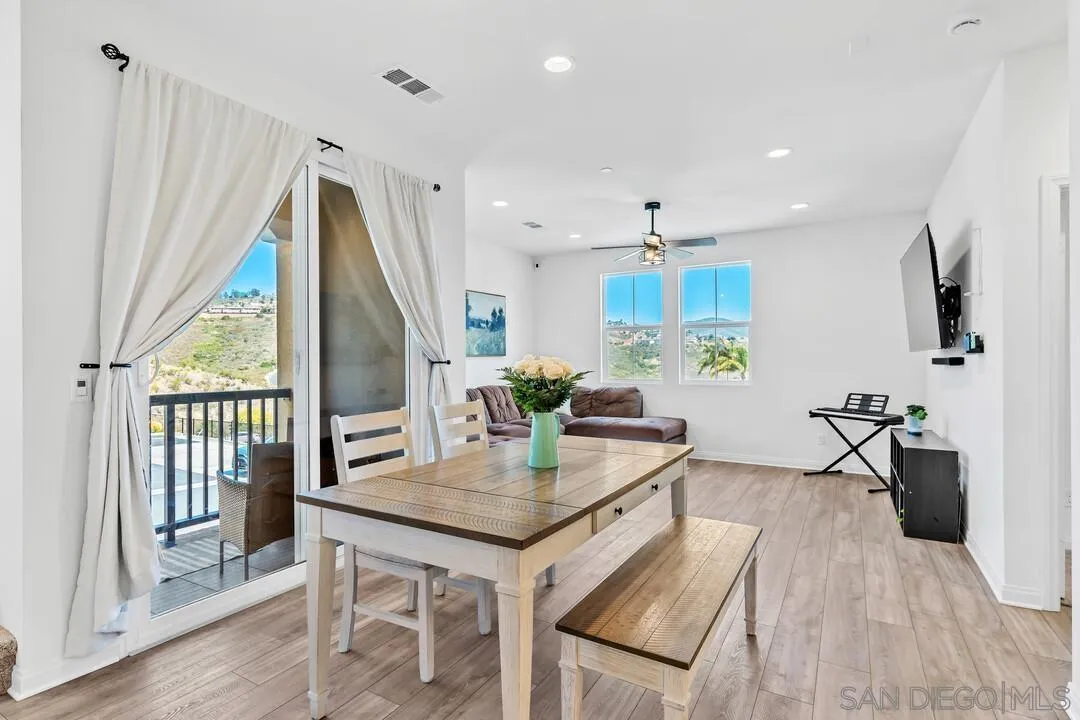 2811 Safflower Street Spring Valley, CA 91977 - Photo 8 of 28 a view of a dining room with furniture window and wooden floor