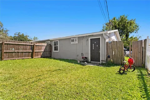 a backyard of a house with seating space