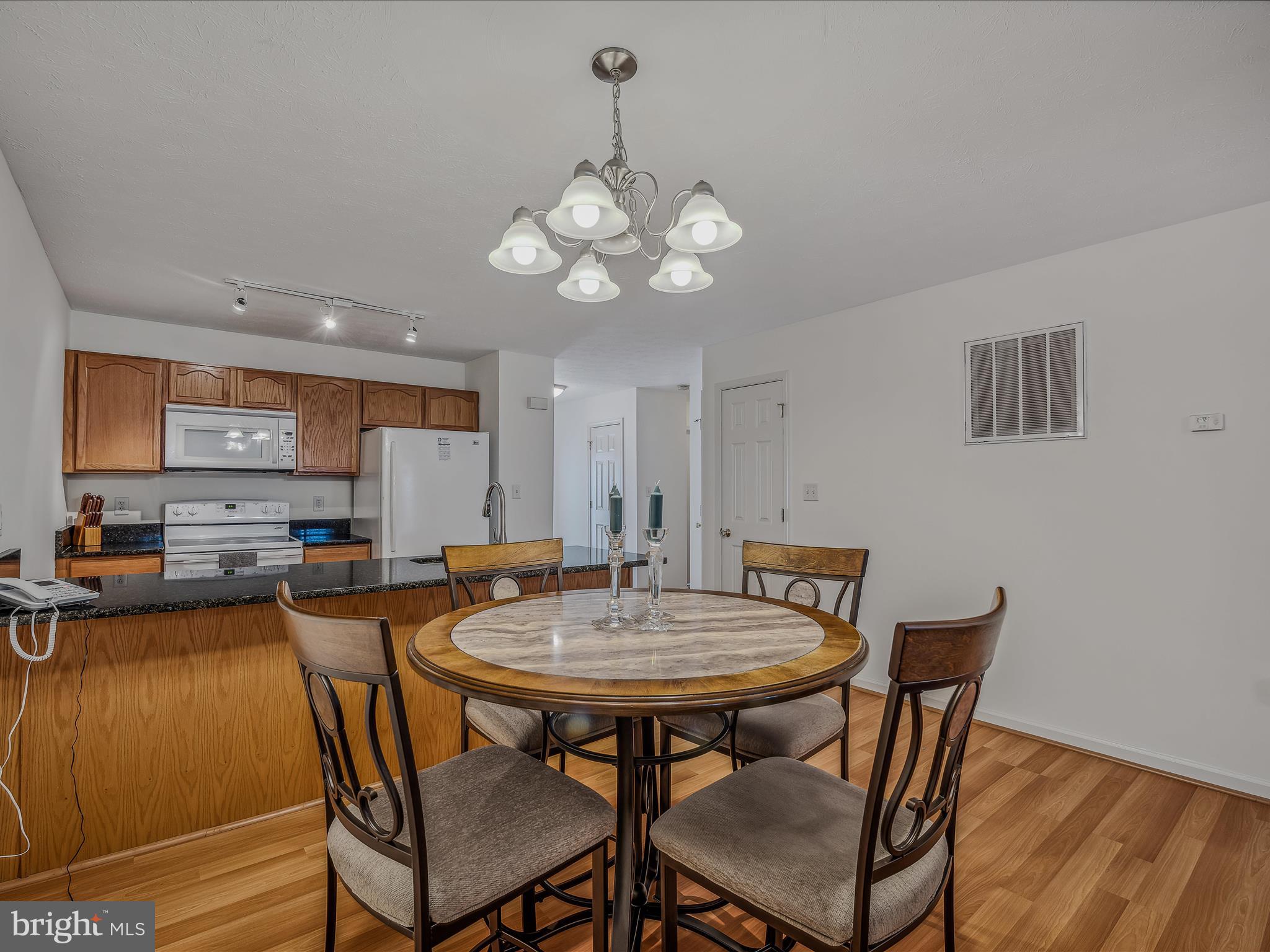 76 Peter Rabbit Drive Ranson, WV 25438 - Photo 11 of 37 dining table. Decorative fixture defines the space