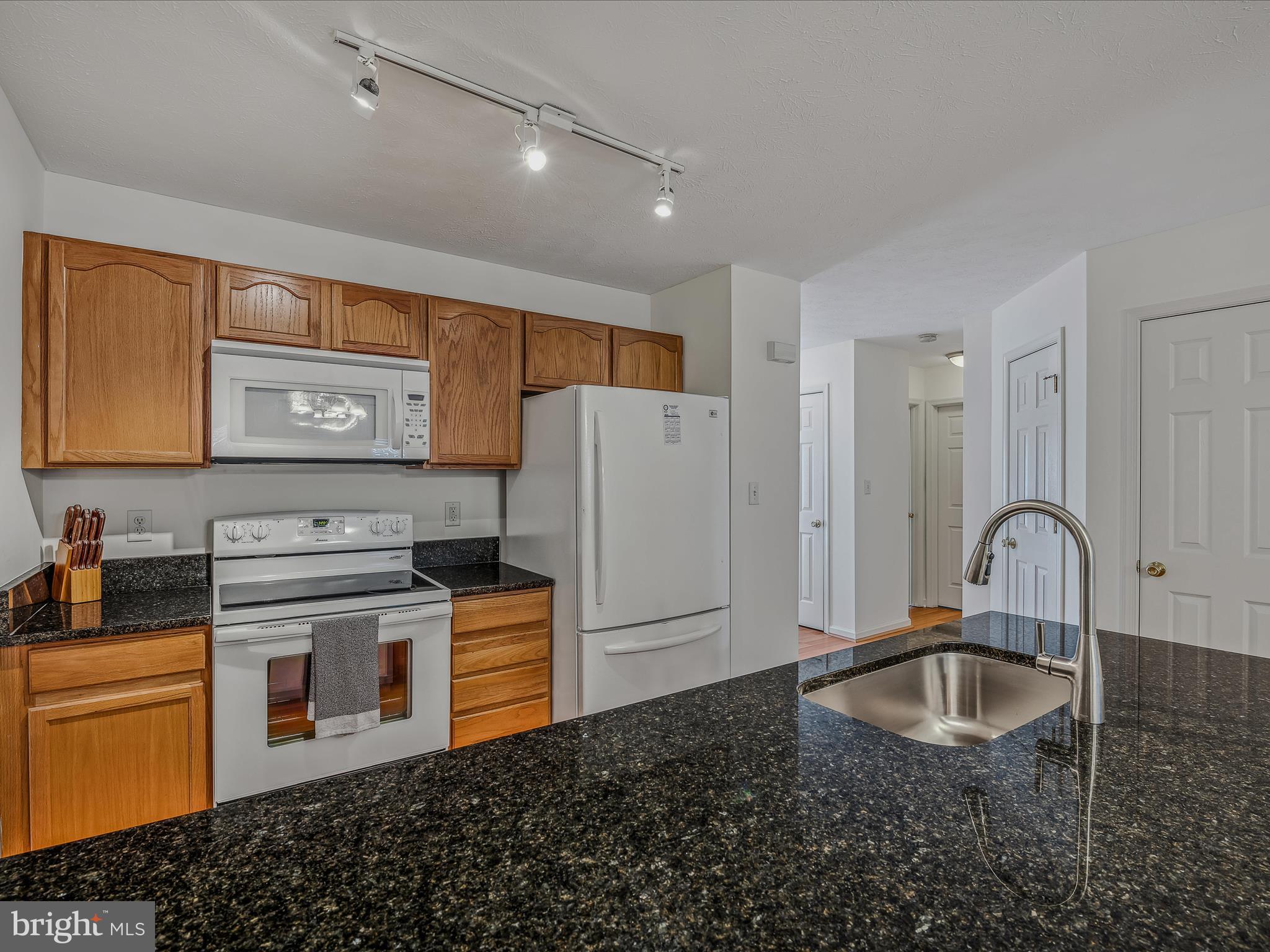 76 Peter Rabbit Drive Ranson, WV 25438 - Photo 6 of 37 Down the hall you have an efficient galley kitchen