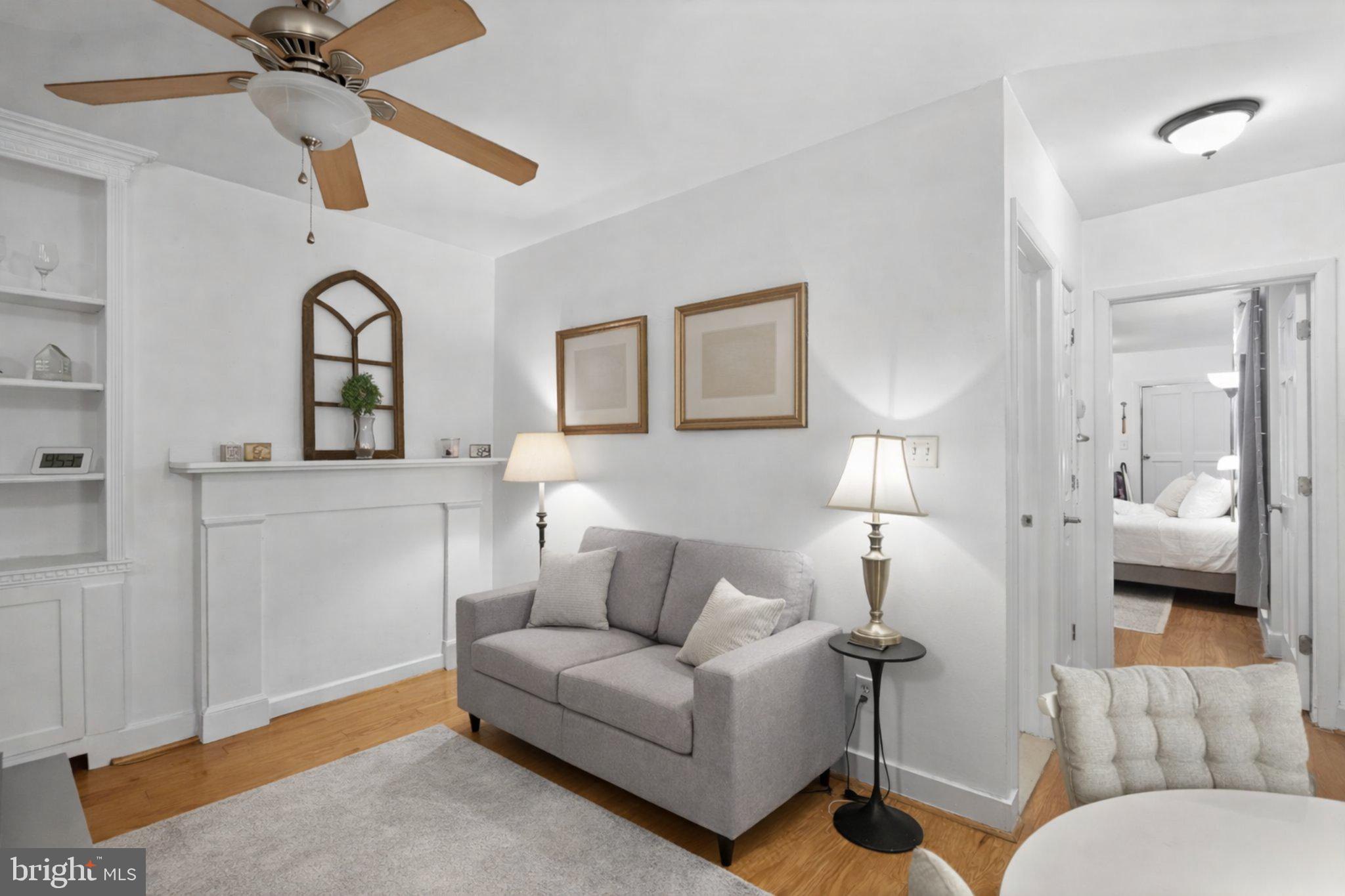 1431 Spruce Street, Unit 1R Philadelphia, PA 19102 - Photo 3 of 20 a living room with furniture and a ceiling fan