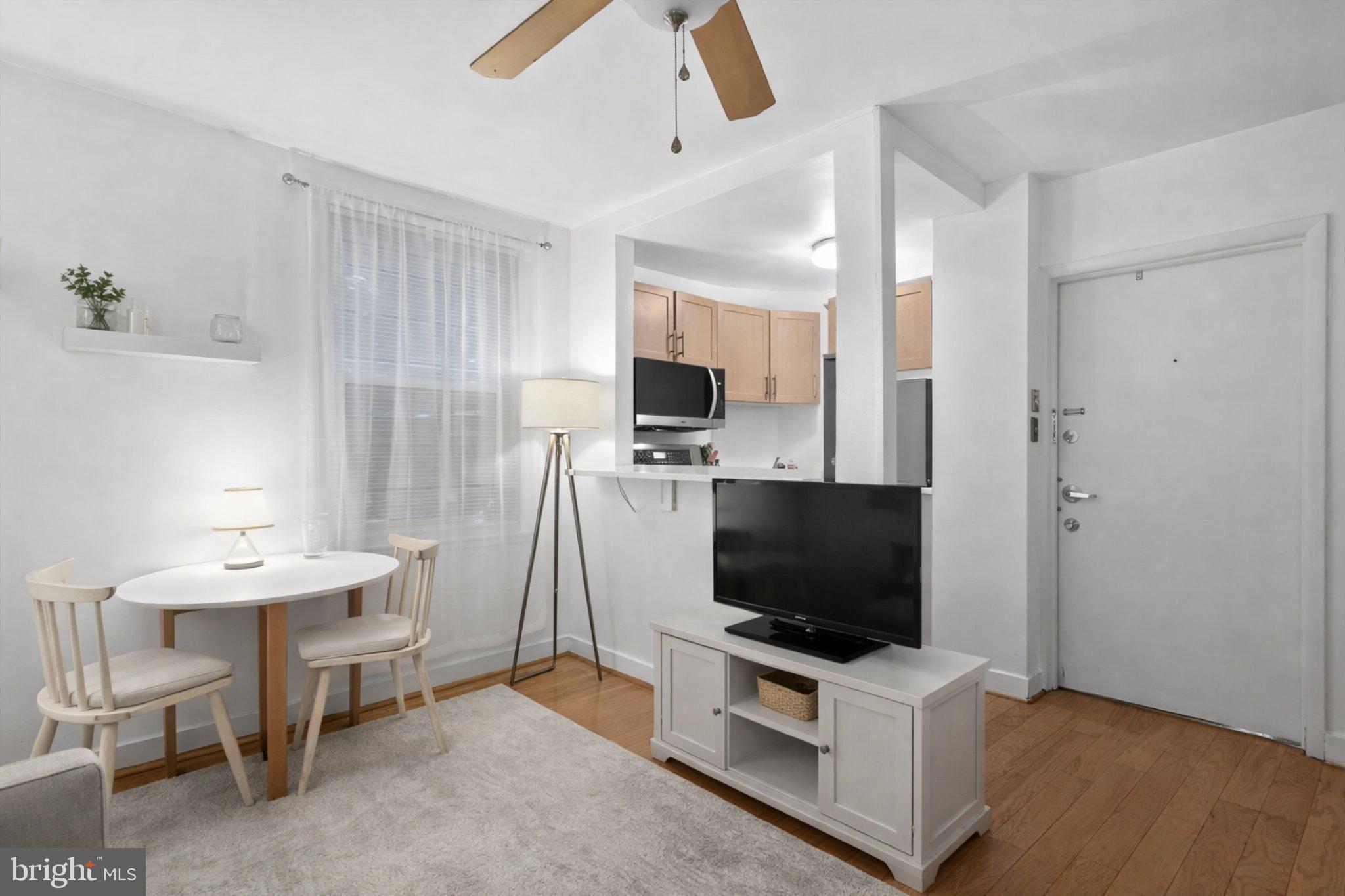 1431 Spruce Street, Unit 1R Philadelphia, PA 19102 - Photo 5 of 20 a living room with furniture and a flat screen tv