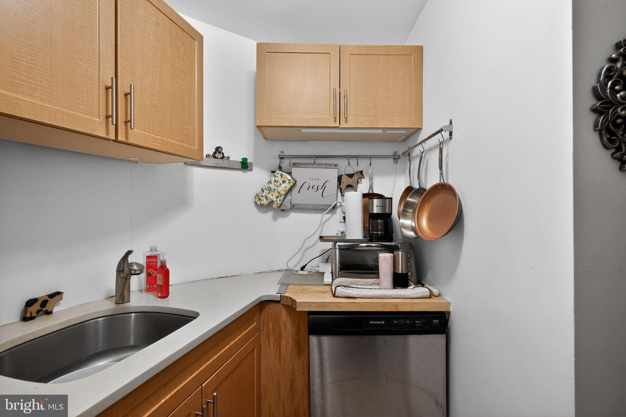1431 Spruce Street, Unit 1R Philadelphia, PA 19102 - Photo 7 of 20 a kitchen with a sink and a stove