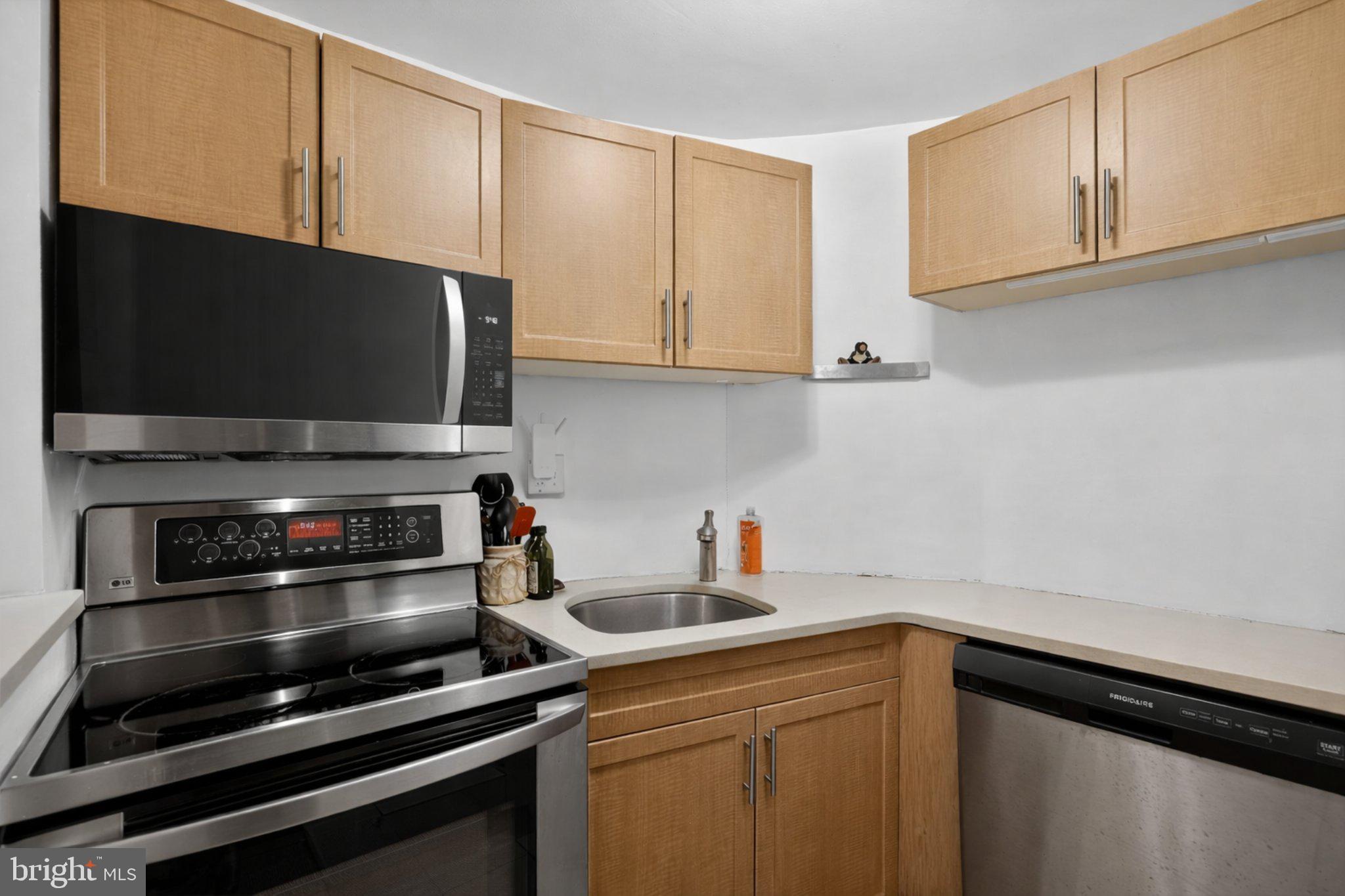 1431 Spruce Street, Unit 1R Philadelphia, PA 19102 - Photo 9 of 20 a kitchen with a sink and cabinets