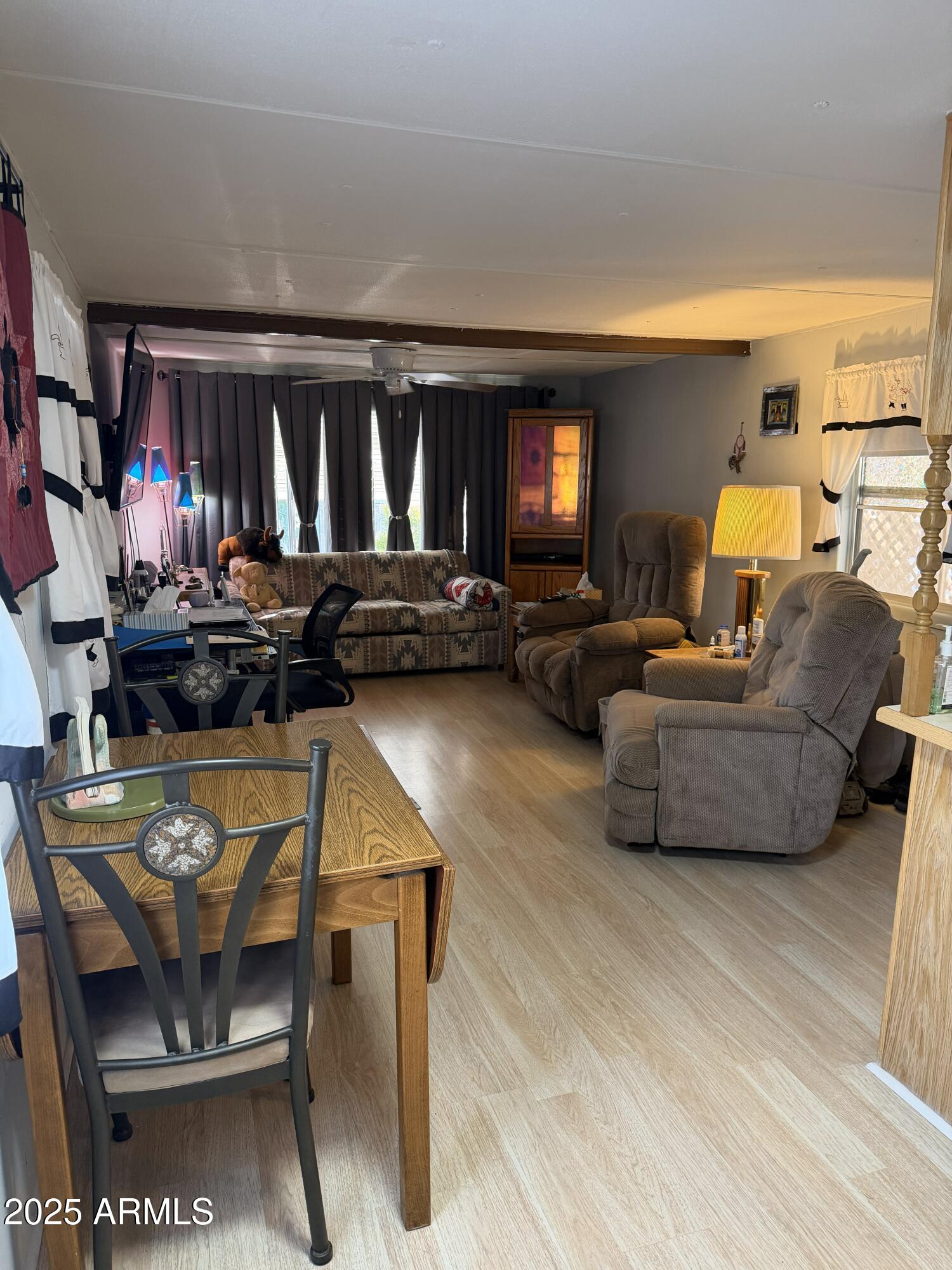 939 North Acacia Road, Unit 20 Apache Junction, AZ 85119 - Photo 3 of 10 a living room with furniture and a fireplace