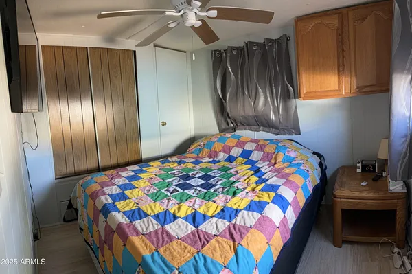 a bedroom with bed and a window