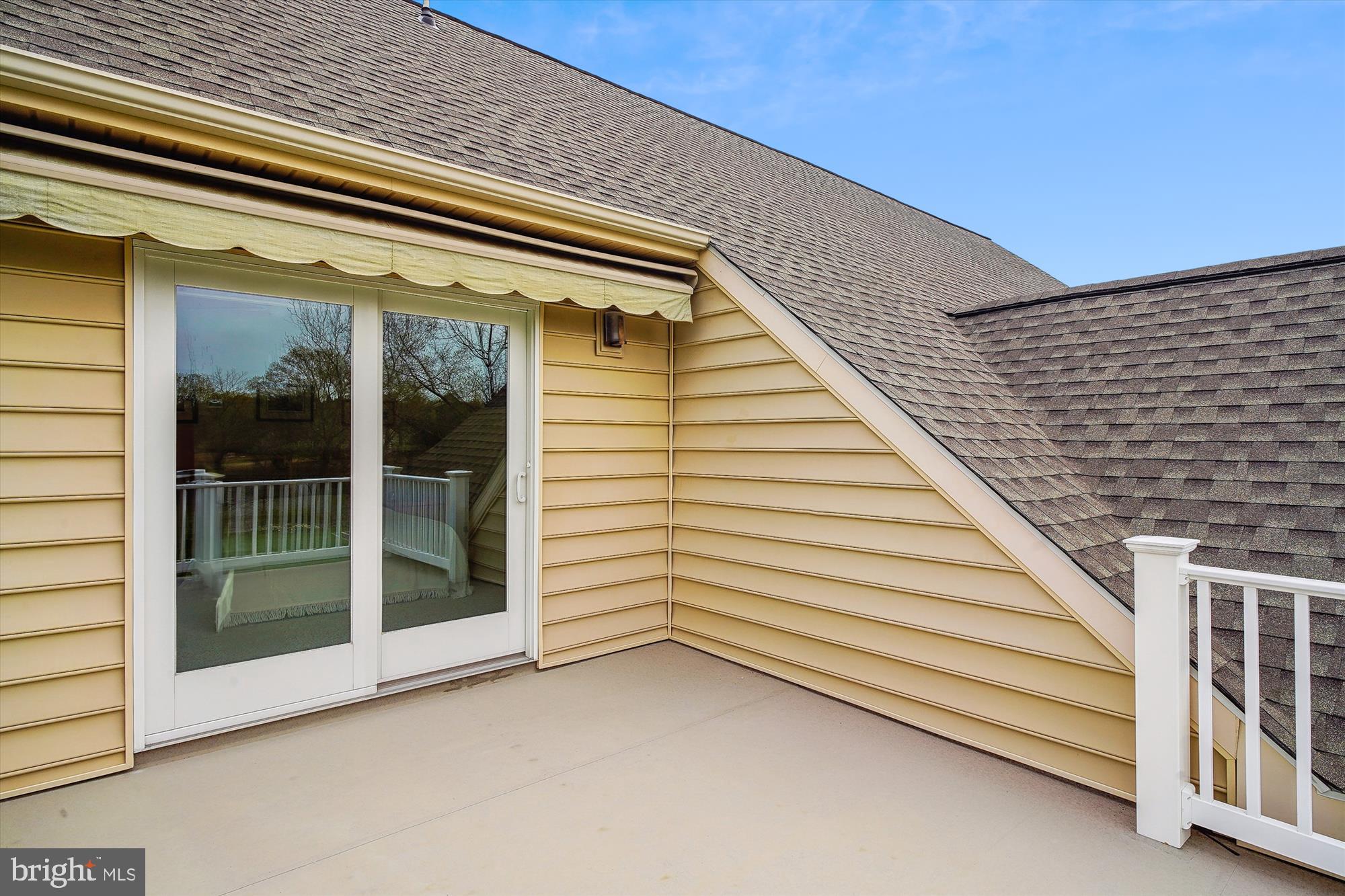 28090 Glebe Road Easton, MD 21601 - Photo 79 of 115 Slider to bedroom 3 balcony. Electric awning