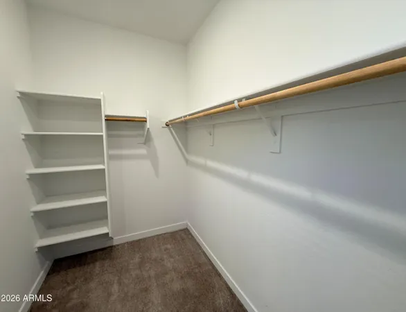 a view of an empty walk in closet
