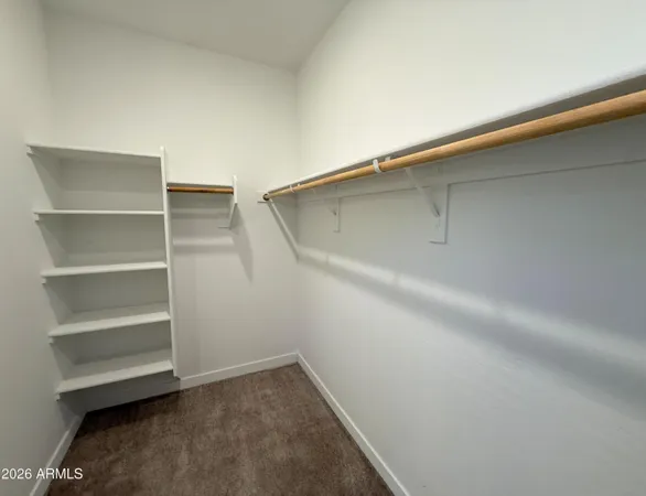 a view of an empty walk in closet