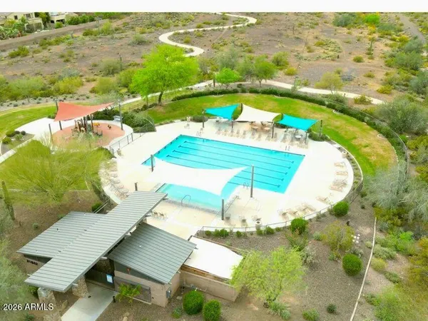 an aerial view of a house with a ocean view
