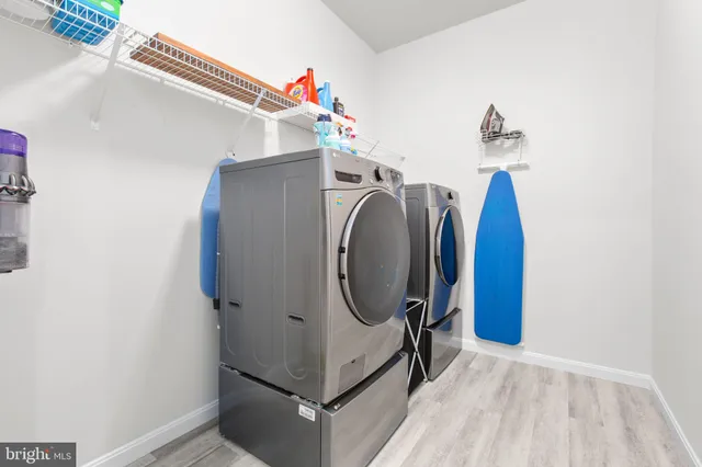 a view of a livingroom with wooden floor and cabinet