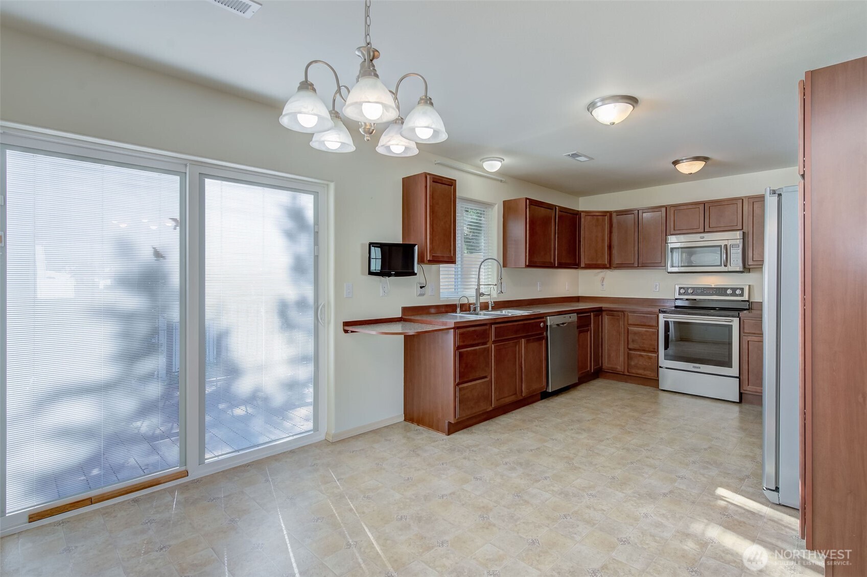 224 Vine Street Cashmere, WA 98815 - Photo 13 of 35 a large kitchen with a large window and stainless steel appliances