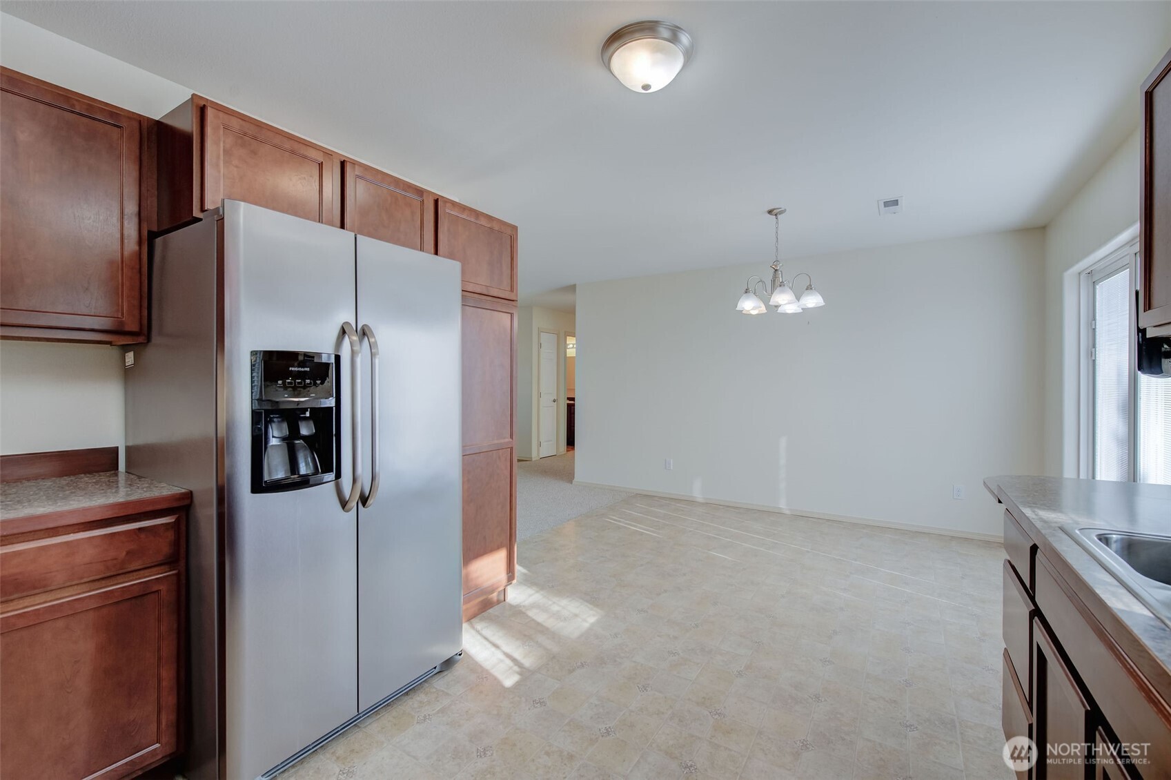 224 Vine Street Cashmere, WA 98815 - Photo 18 of 35 a kitchen with stainless steel appliances a refrigerator and a stove
