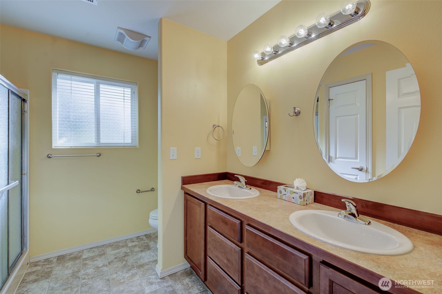 224 Vine Street Cashmere, WA 98815 - Photo 21 of 35 a bathroom with a granite countertop double vanity sinks and a mirror