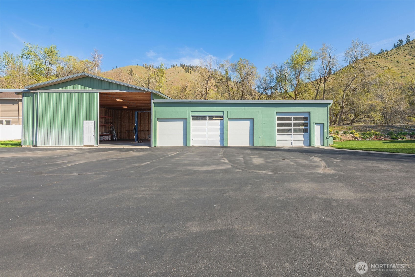 224 Vine Street Cashmere, WA 98815 - Photo 31 of 35 a view of a house with a yard and garage