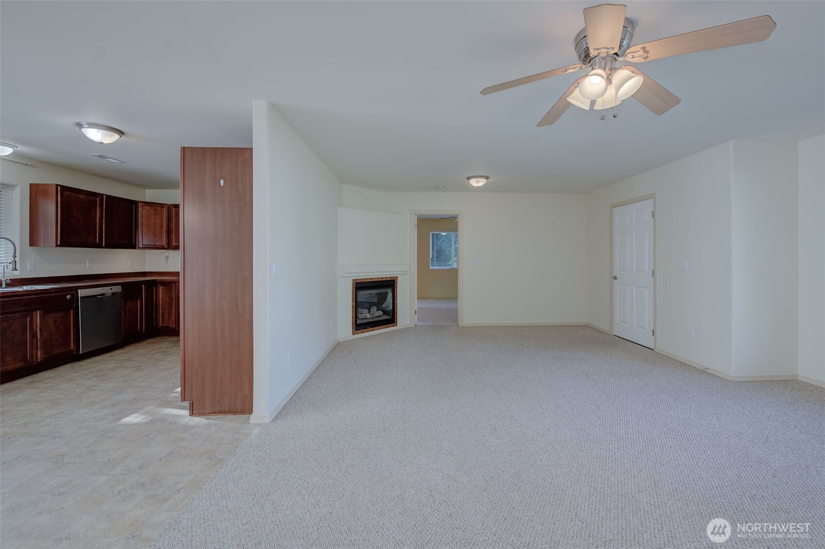 224 Vine Street Cashmere, WA 98815 - Photo 10 of 35 a view of an empty room with kitchen microwave and a refrigerator
