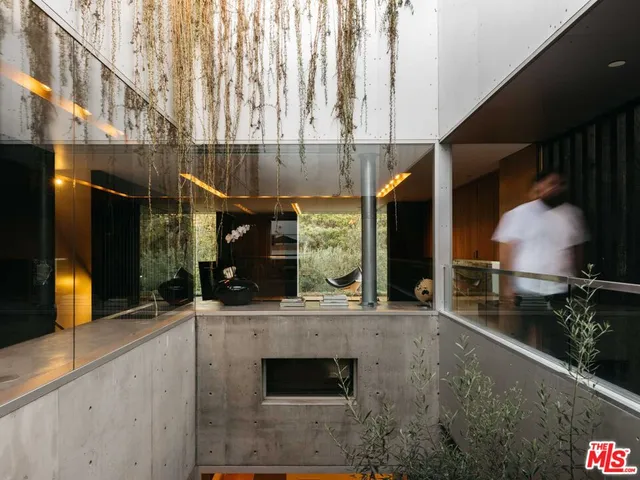 a kitchen with stainless steel appliances kitchen island granite countertop a sink and a stove