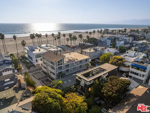 a view of a swimming pool with outdoor seating