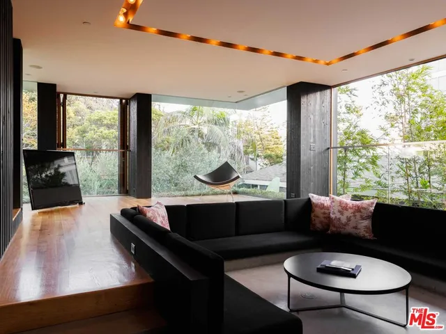 a balcony with table and chairs