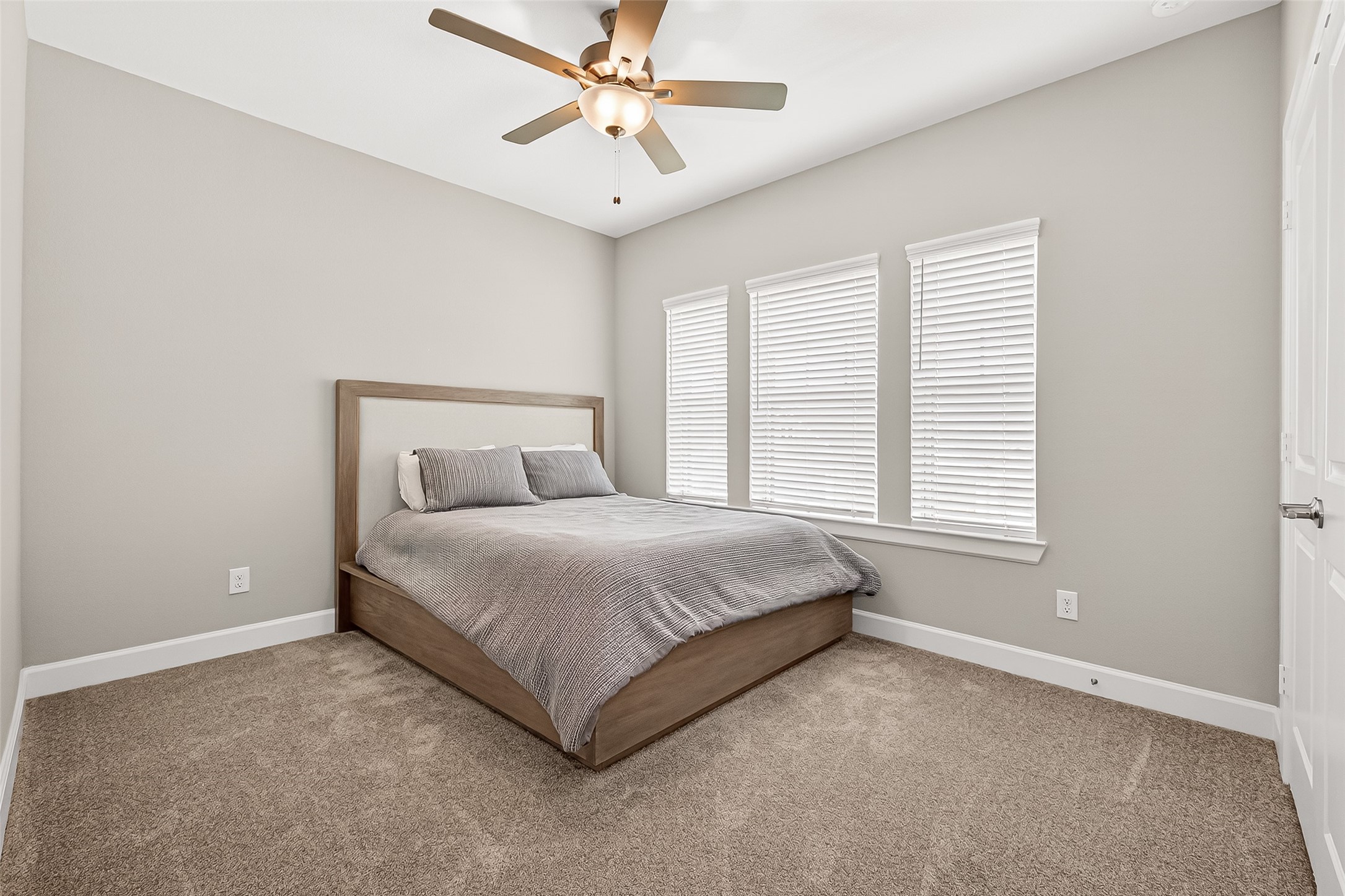 11226 Common Hackberry Street Cypress, TX 77433 - Photo 11 of 17 a spacious bedroom with a bed and a window