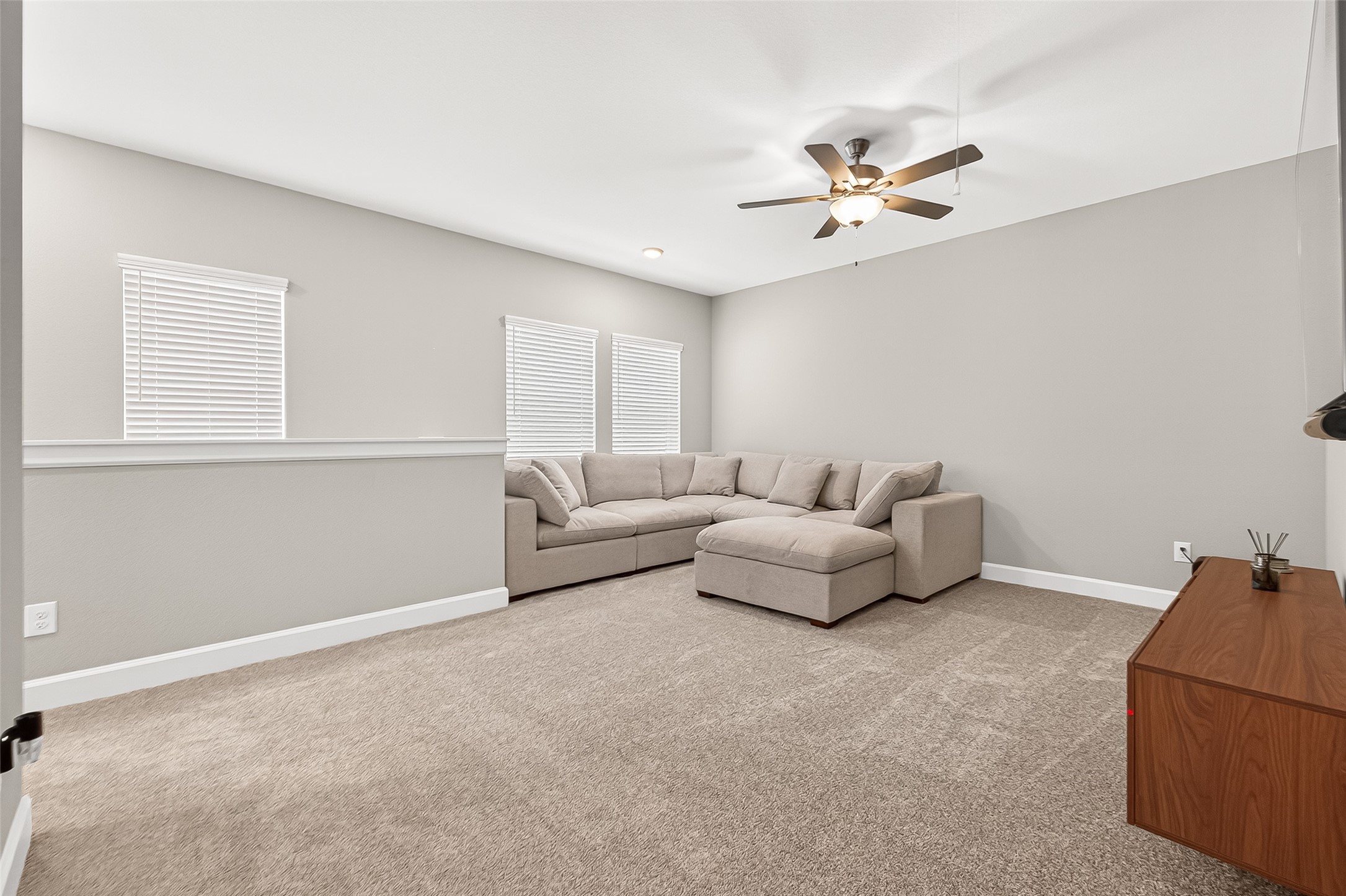 11226 Common Hackberry Street Cypress, TX 77433 - Photo 14 of 17 a living room with furniture and a ceiling fan