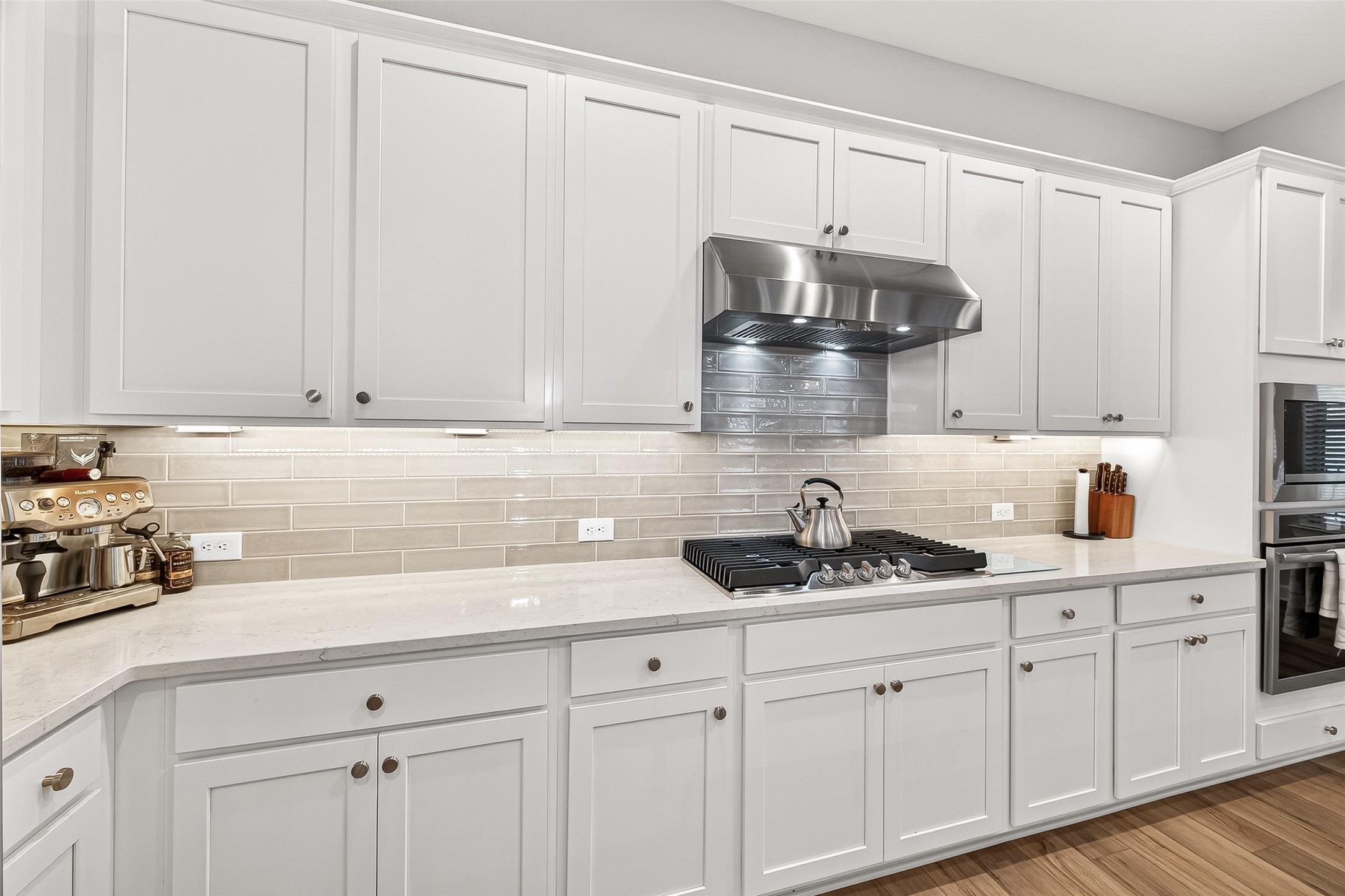 11226 Common Hackberry Street Cypress, TX 77433 - Photo 6 of 17 a kitchen with stainless steel appliances granite countertop white cabinets a sink and dishwasher