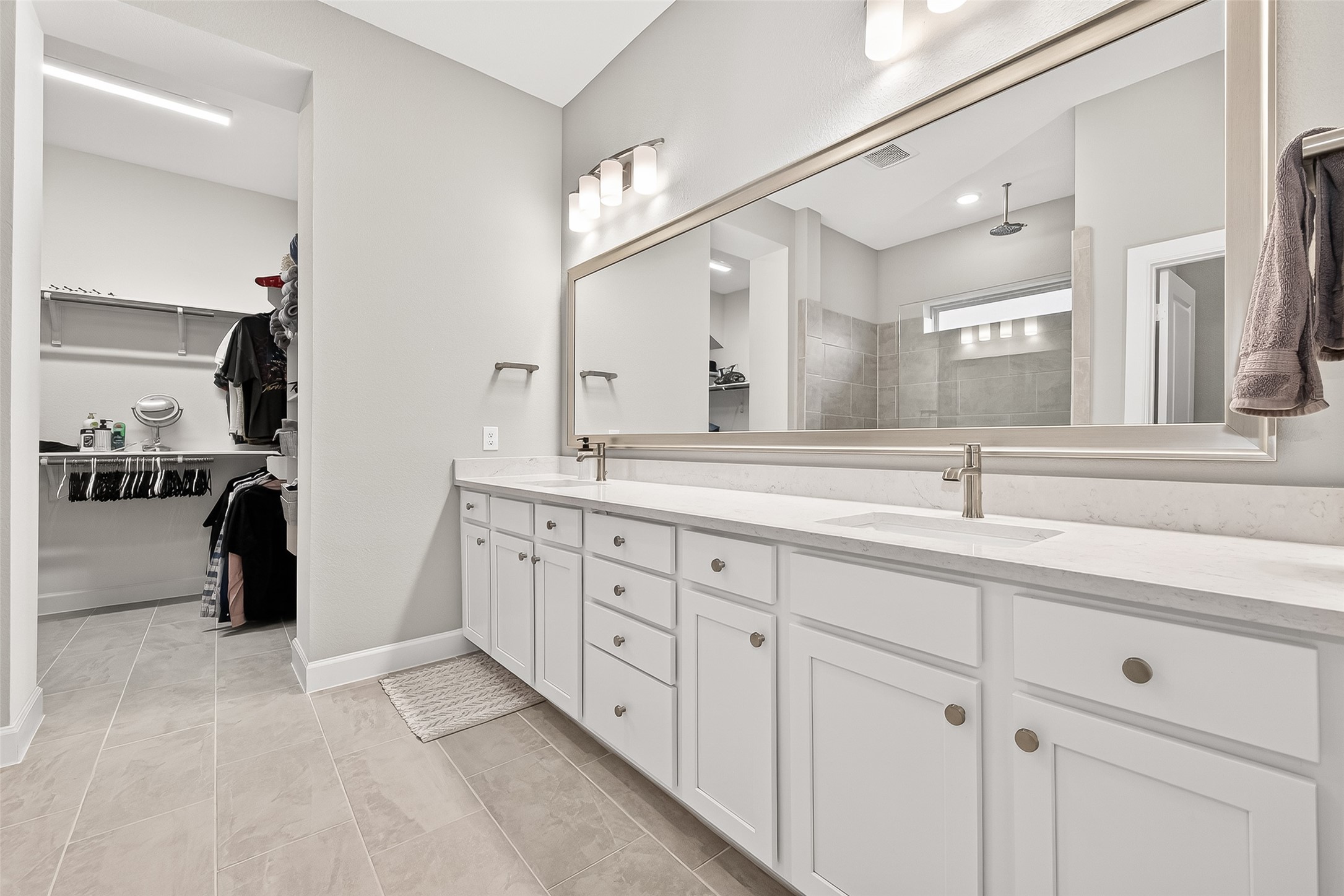 11226 Common Hackberry Street Cypress, TX 77433 - Photo 9 of 17 a spacious bathroom with a double vanity sink double and mirror