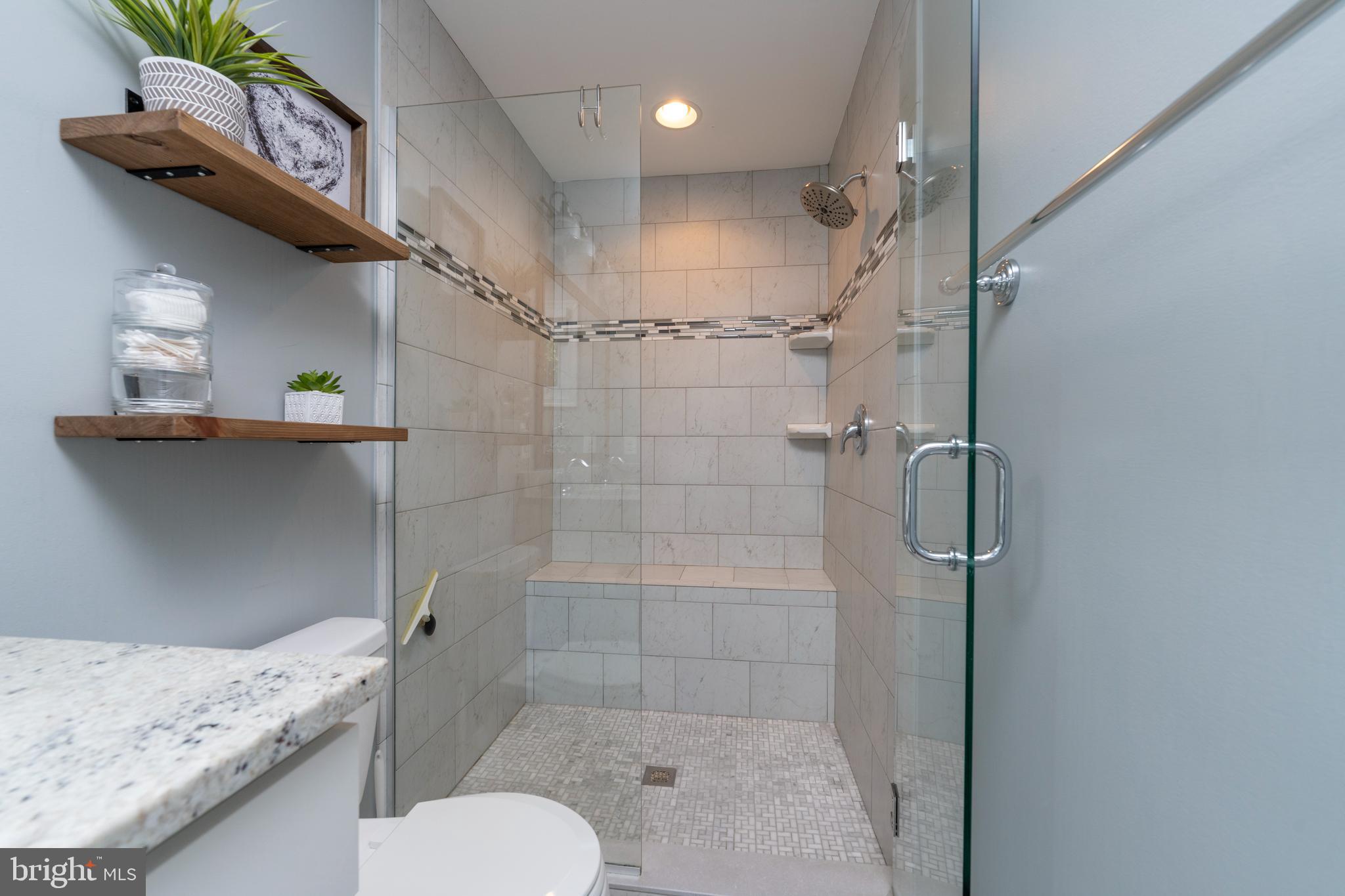 209 Charmuth Road Lutherville-Timonium, MD 21093 - Photo 18 of 43 Primary Bathjrrom Shower with Bench