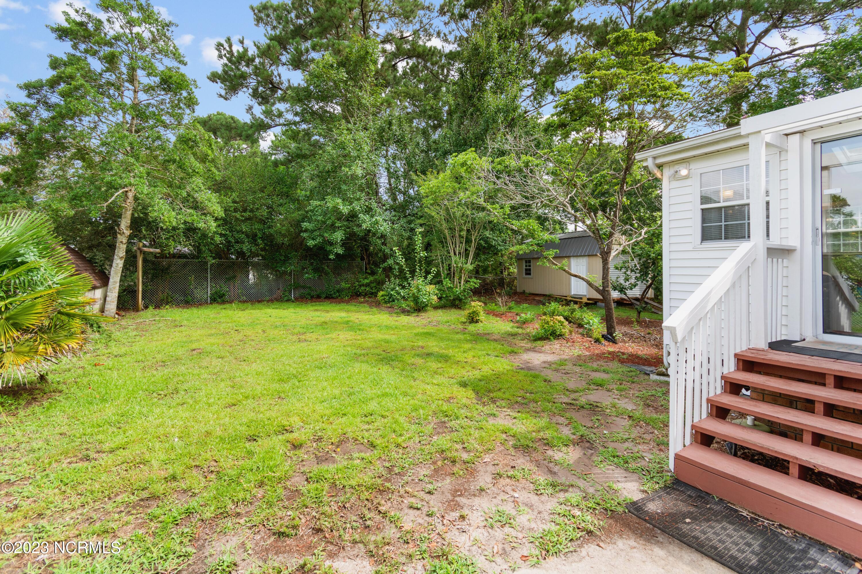 4405 Rounding Run Road Southwest Shallotte, NC 28470 - Photo 25 of 31 Back yard off sunroom