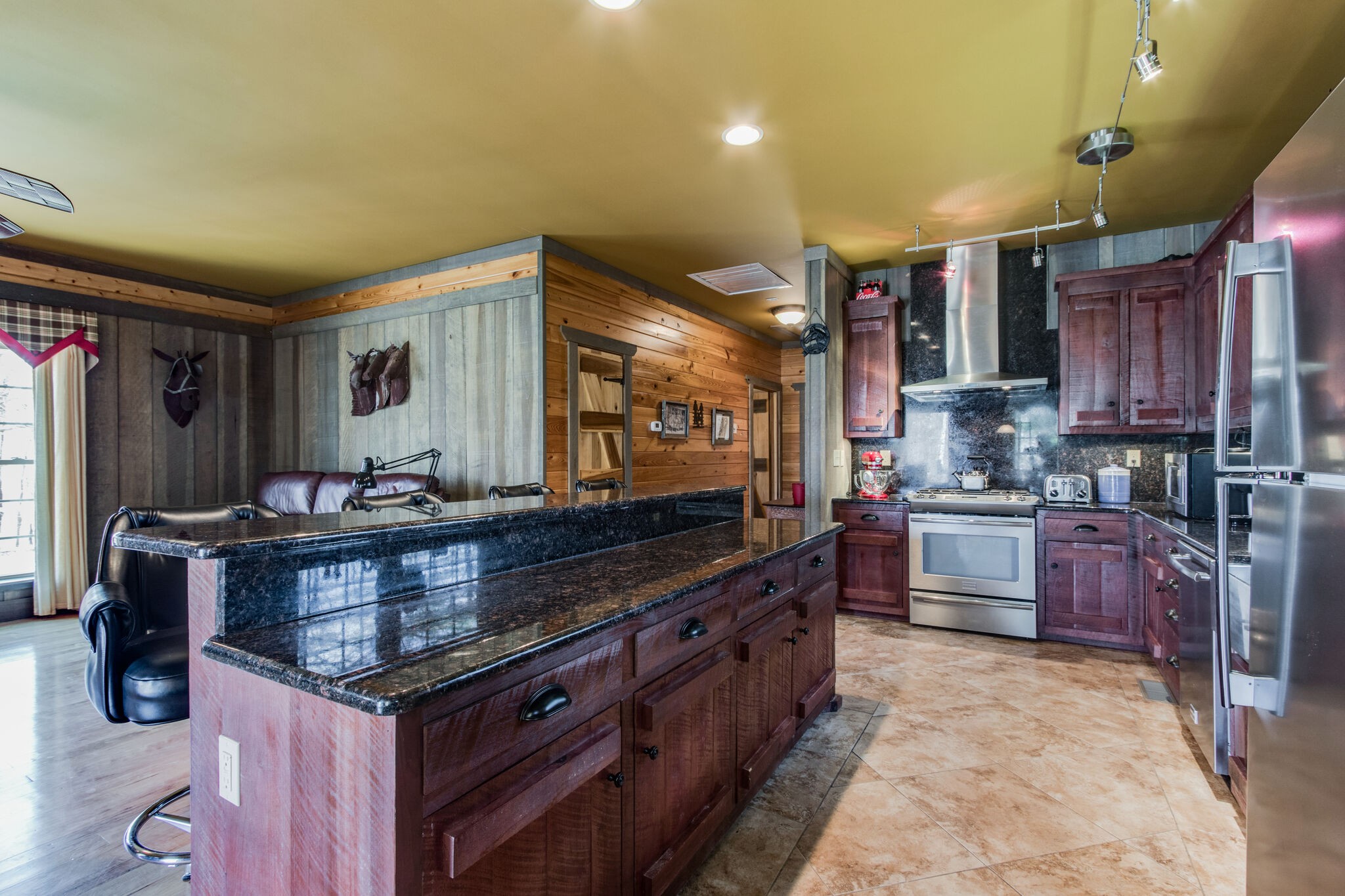 210 Double Check Lane Belvidere, TN 37306 - Photo 11 of 48 a kitchen with stainless steel appliances granite countertop a stove a sink and a refrigerator