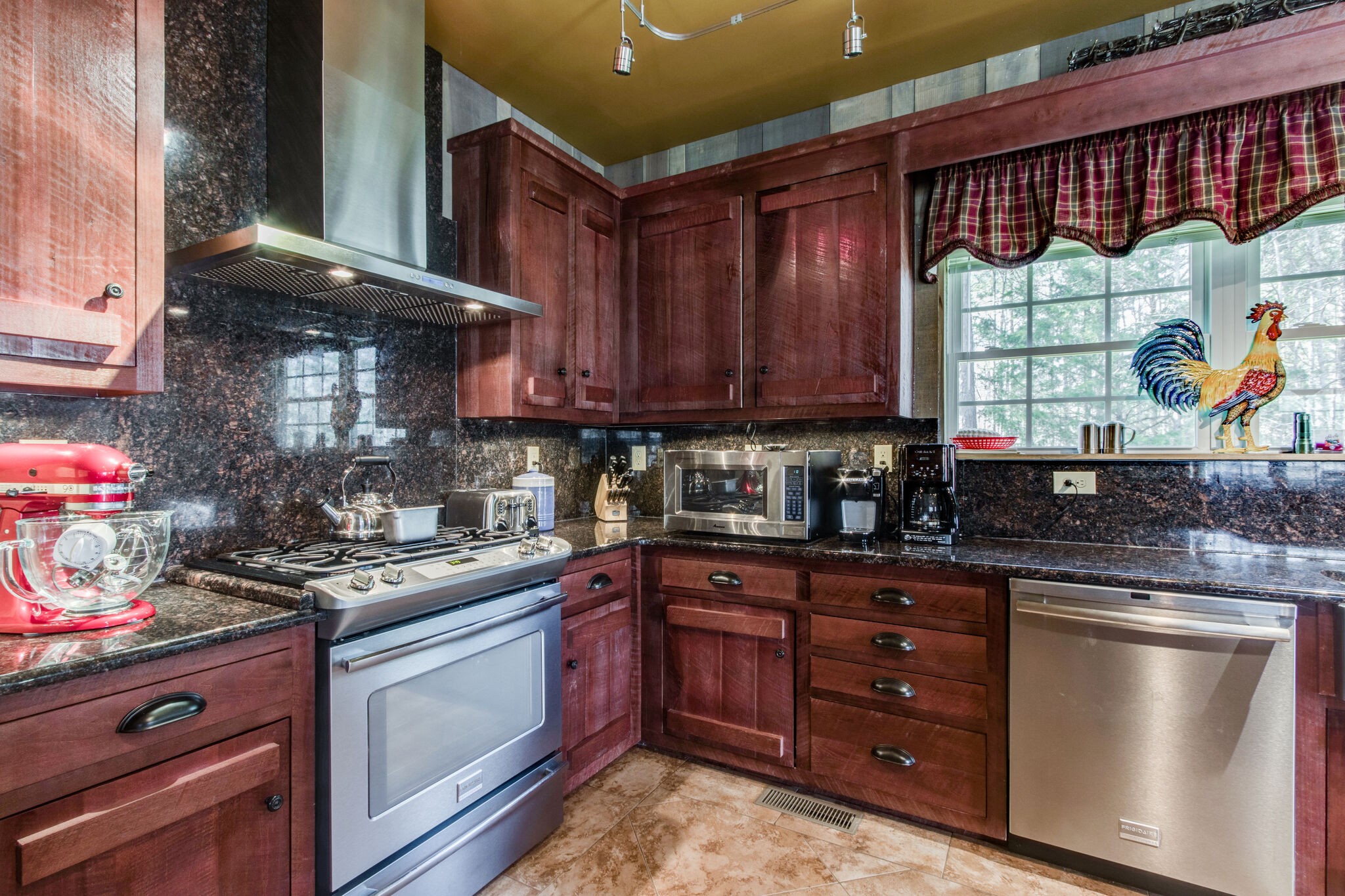 210 Double Check Lane Belvidere, TN 37306 - Photo 13 of 48 a kitchen with stainless steel appliances granite countertop a stove a sink and a microwave